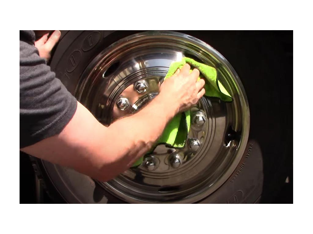 Kenny cleaning RV tire