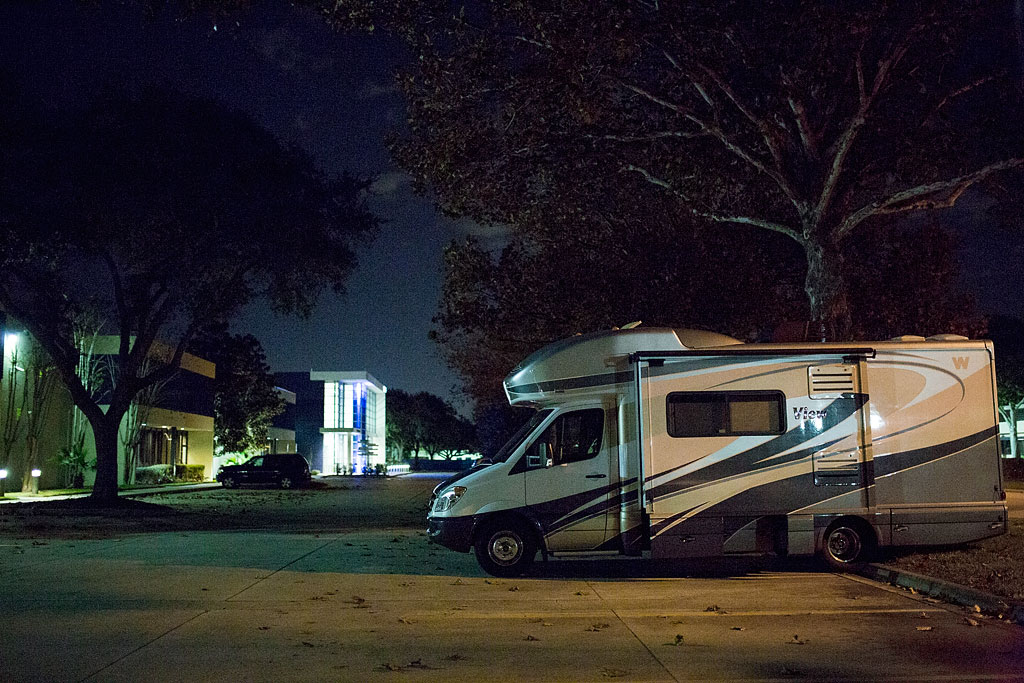 Winnebago View parked in NBC Golf parking lot at night.