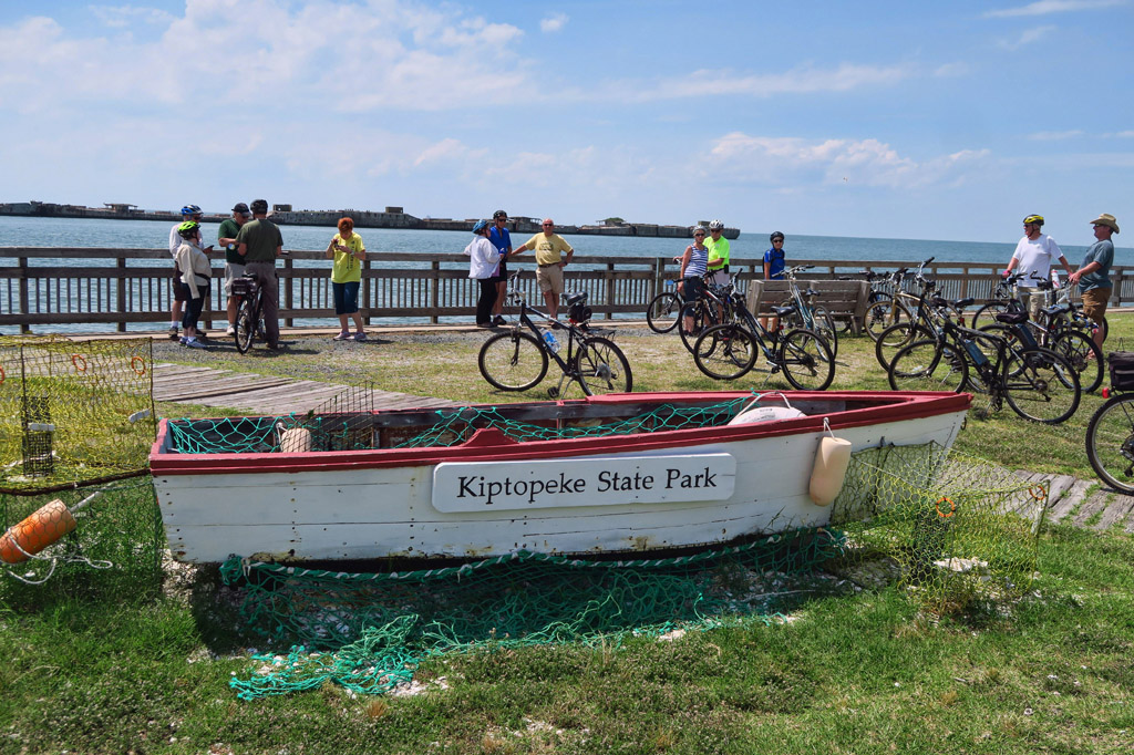 Group standing next to their bikes along the water at Kiptopeke State Park.