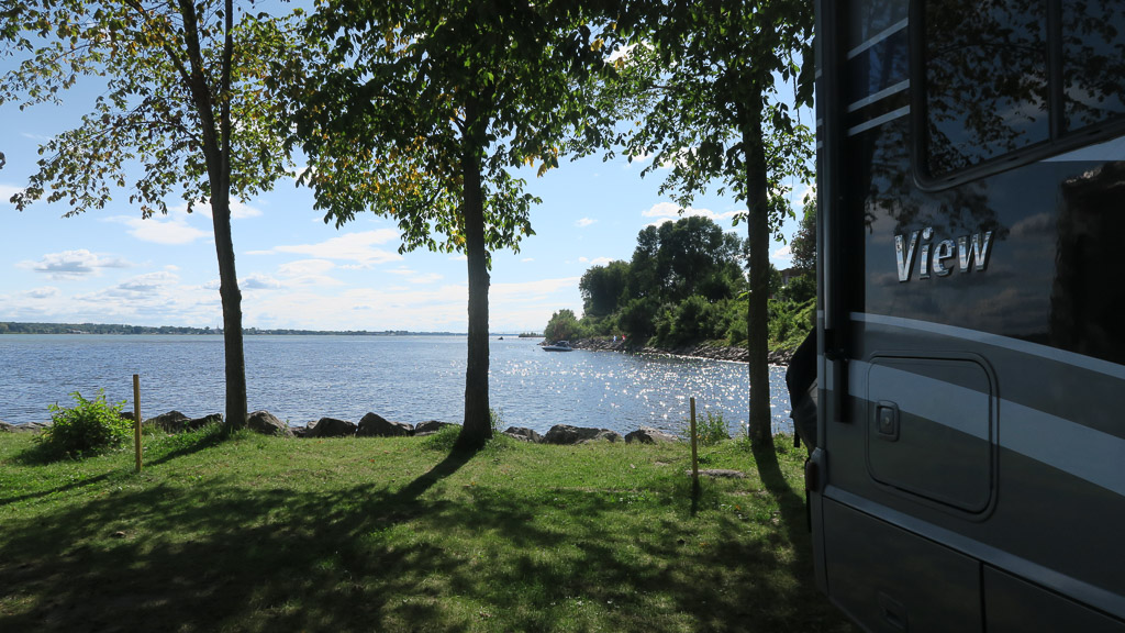 Winnebago View parked in grass in front of lake