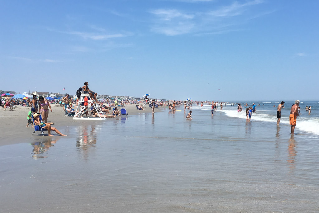 Crowds of people along the beach at Ocean City
